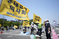 Members of The Korea Medical Association arrive for a rally against the government's medical policy in Seoul, South Korea, Tuesday, June 18, 2024. South Korean officials issued return-to-work orders for doctors participating in a one-day walkout Tuesday as part of a protracted strike against government plans to boost medical school admissions, starting next year. (AP Photo/Lee Jin-man)
