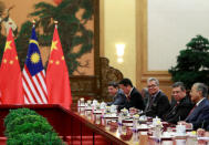 Malaysia's Prime Minister Mahathir Mohamad speaks to China's Premier Li Keqiang (not pictured) during their meeting at the Great Hall of the People in Beijing, China, August 20, 2018. How Hwee Young/Pool via REUTERS