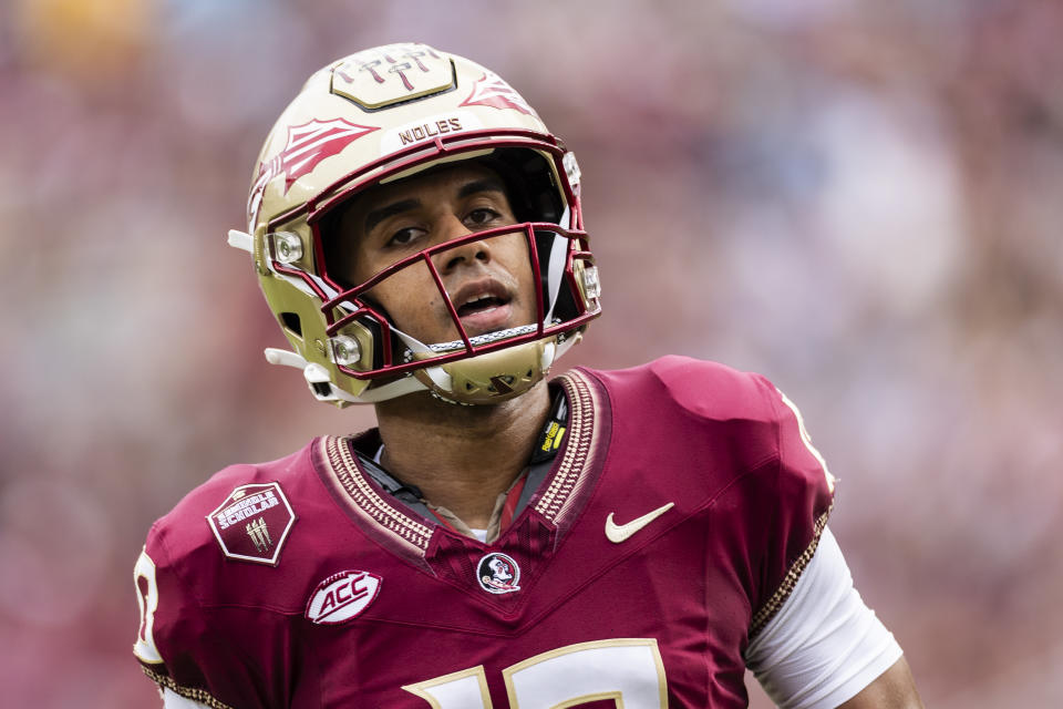 TALLAHASSEE, FLORIDA - NOVEMBER 11: Jordan Travis #13 of the Florida State Seminoles looks on before the start of a game against the Miami Hurricanes at Doak Campbell Stadium on November 11, 2023 in Tallahassee, Florida. (Photo by James Gilbert/Getty Images)