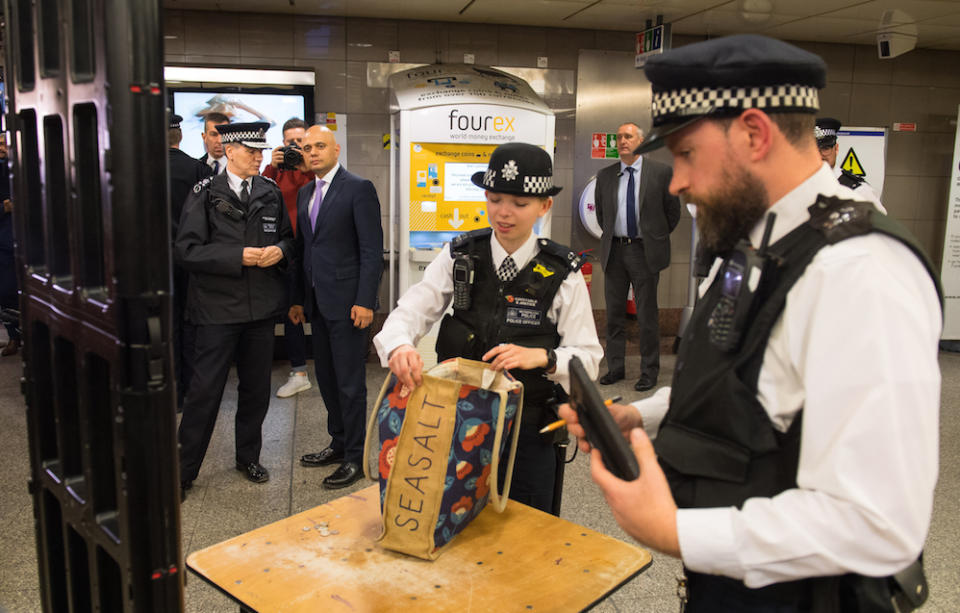 Home secretary Sajid Javid and Metropolitan Police Deputy Commissioner Steve House observe a bag search during a visit to Angel underground station in London (Picture: PA)