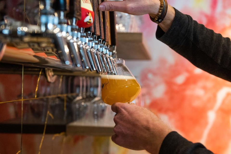 Sean Bowman, owner of Foreign Objects Brewery, pours a glass of beer at Foreign Objects Brewery in Monroe, NY, on Thursday, January 13, 2022.