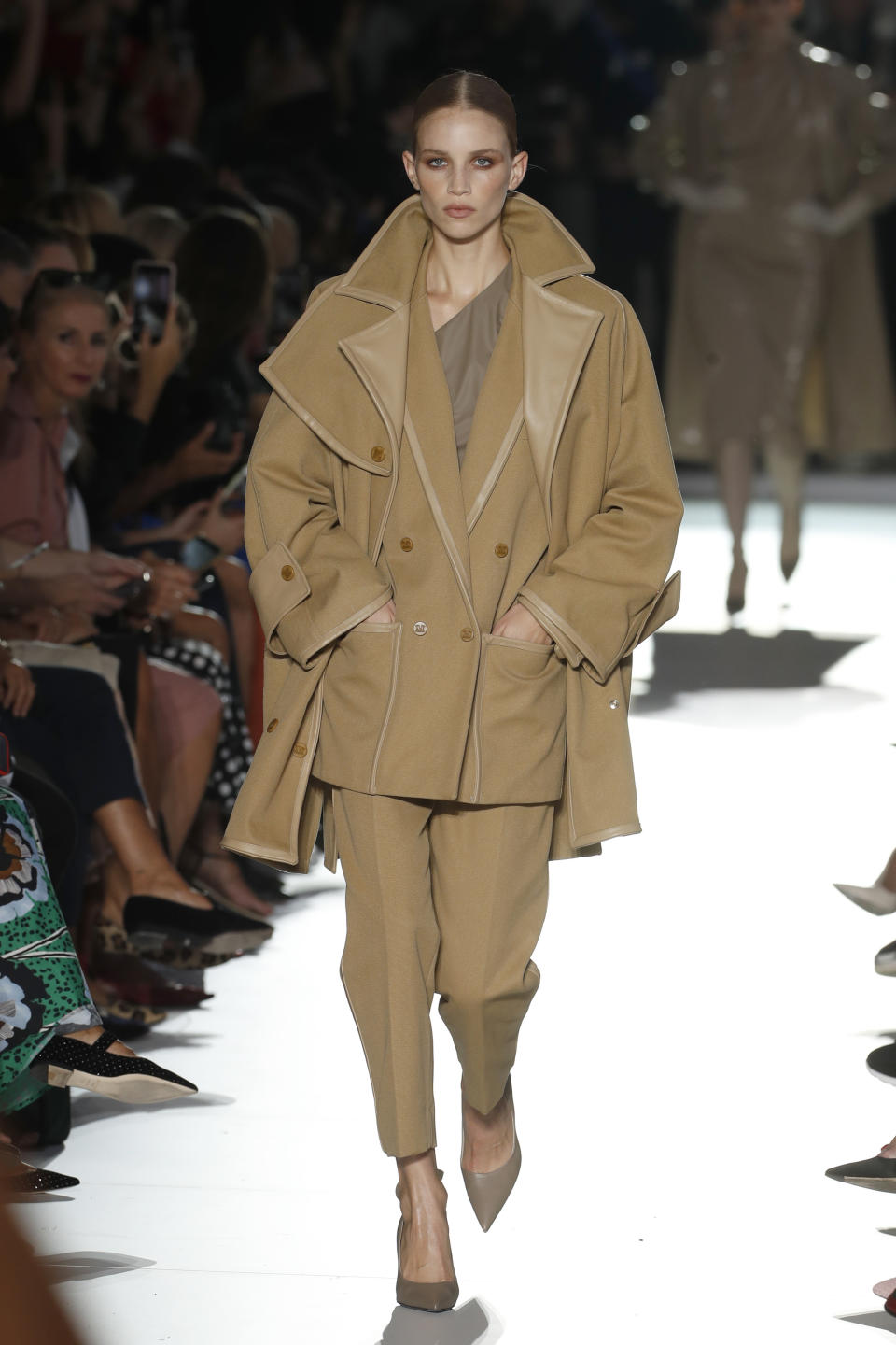 A model wears a creation as part of the Max Mara women's 2019 Spring-Summer collection, unveiled during the Fashion Week in Milan, Italy, Thursday, Sept. 20, 2018. (AP Photo/Antonio Calanni)