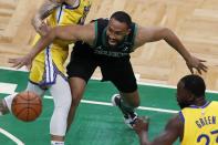 Boston Celtics'Jabari Parker, center, and Golden State Warriors' Draymond Green (23) scramble for the ball during the first half of an NBA basketball game, Saturday, April 17, 2021, in Boston. (AP Photo/Michael Dwyer)