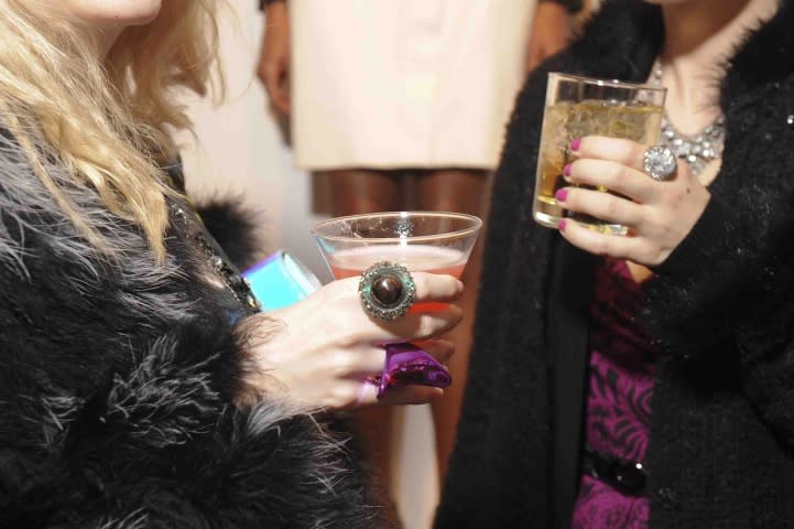 Partygoers enjoying cocktails.