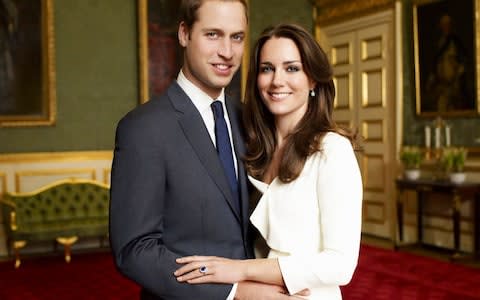 Prince William and Kate Middleton pose in their official engagement photo in 2010 - Credit: Mario Testino