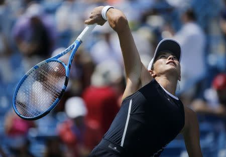 Aug 20, 2017; Mason, OH, USA; Garbine Muguruza serves in the first set of the womens finals match against Simona Halep during the Western & Southern Open at the Lindner Family Tennis Center. Mandatory Credit: Sam Greene/The Cincinnati Enquirer via USA TODAY NETWORK