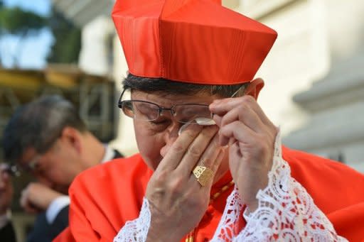 Philippines' Luis Antonio Tagle sheds a tear after being appointed a cardinal at St Peter's basilica at the Vatican on Saturday. Pope Benedict XVI on Saturday officially named six new non-European cardinals to the body that will elect his successor, saying the move underlined the Church's diversity