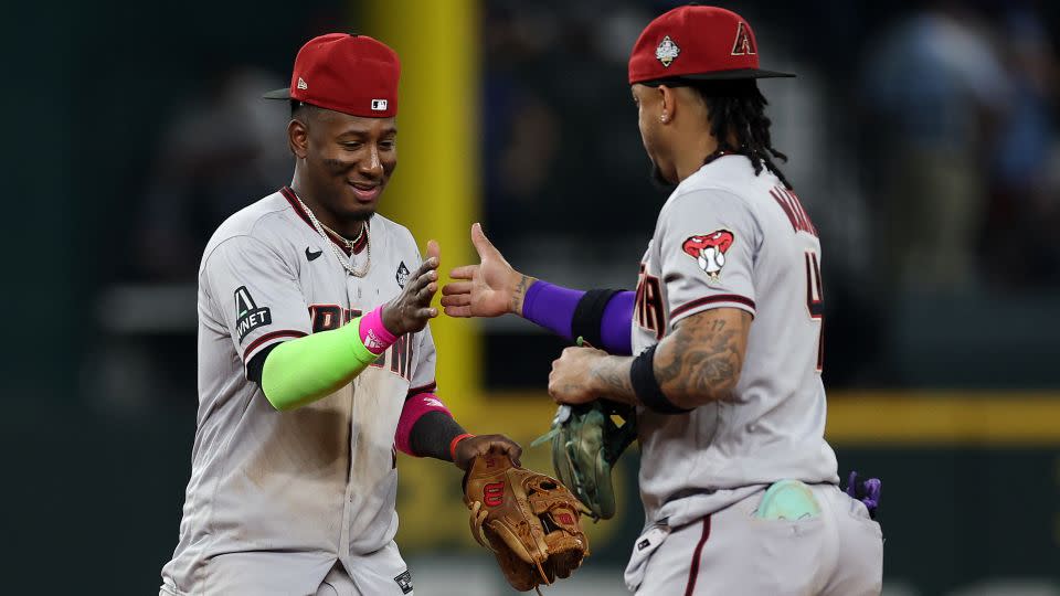 Geraldo Perdomo and Ketel Marte (right) celebrate after beating the Texas Rangers 9-1. - Jamie Squire/Getty Images