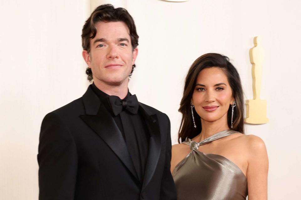 <p>Arturo Holmes/Getty</p> John Mulaney and Olivia Munn attend the 2024 Oscars in coordinating custom Fendi looks.