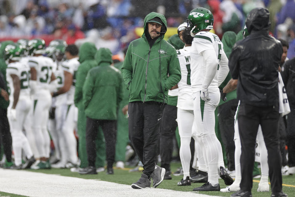 New York Jets quarterback Aaron Rodgers (8) stands on the sidelines during the first half of an NFL football game against the New York Giants, Sunday, Oct. 29, 2023, in East Rutherford, N.J. (AP Photo/Adam Hunger)