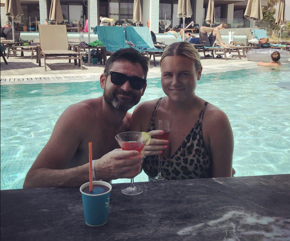 Katherine McAuley and her husband Patrick at a pool on holiday. 