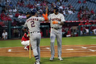 Houston Astros' Jose Siri, right, celebrates his solo home run with Alex Bregman (2) during the first inning of a baseball game against the Los Angeles Angels Monday, Sept. 20, 2021, in Anaheim, Calif. (AP Photo/Marcio Jose Sanchez)