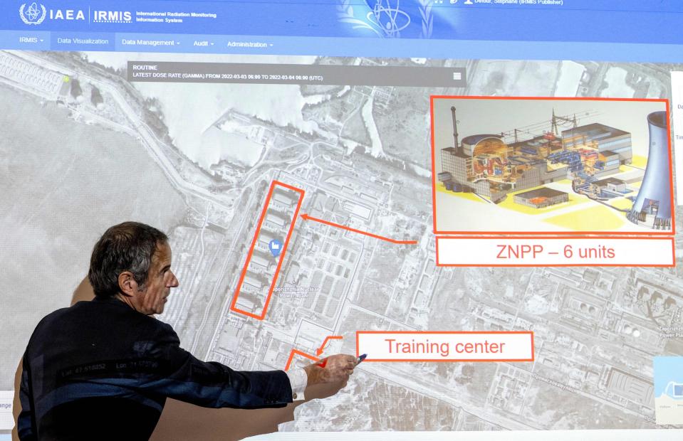 Rafael Grossi, director general of the International Atomic Energy Agency, points to a map.