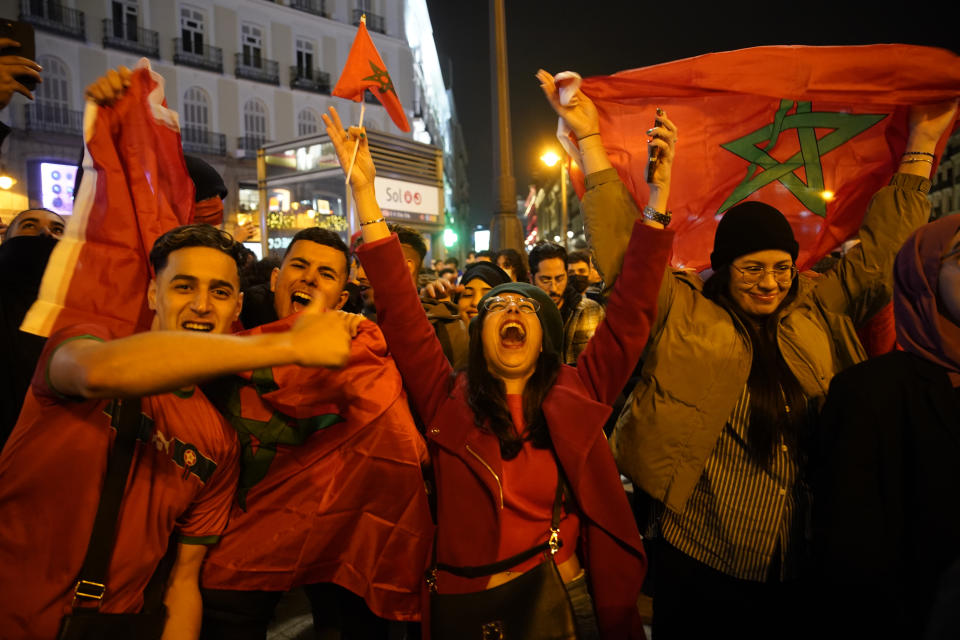 Morocco fans celebrate in the central Puerta del Sol in Madrid, Spain, Tuesday, Dec. 6, 2022. Morocco beat Spain on penalties during a round of 16 World Cup soccer tournament in Qatar. (AP Photo/Andrea Comas)