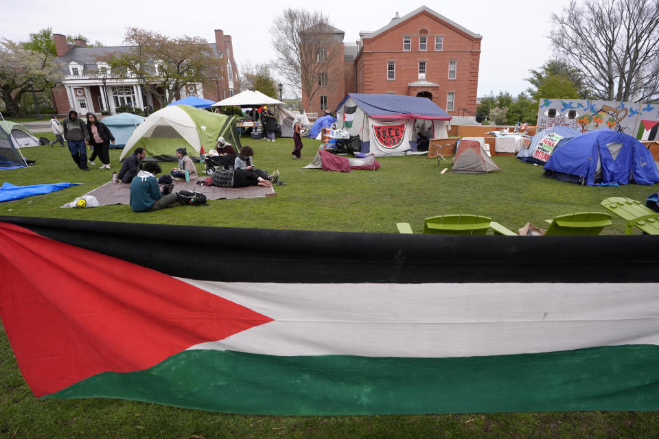 A Palestinian flag hangs on the edge of a tent encampment on the campus of Tufts University, Tuesday, April 30, 2024, in Medford, Mass. Tufts University students set up the encampment as part of a protest against the war in Gaza. (AP Photo/Steven Senne)