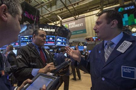 Traders work on the floor of the New York Stock Exchange November 26, 2013. REUTERS/Brendan McDermid