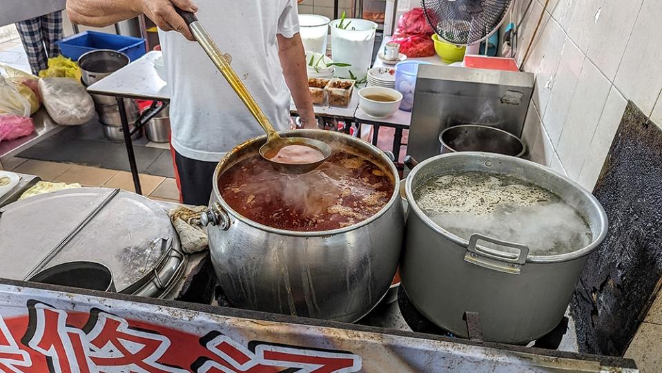 Massive pots of bubbling, simmering broth give a hint of what is to come.