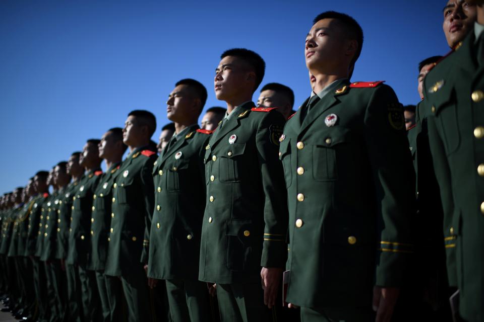 Chinese Paramilitary police officers gather in Beijing's Tiananmen Square ahead of a ceremony marking the 70th anniversary of China's entry into the Korean War, on October 23, 2020. (Photo by NOEL CELIS / AFP) (Photo by NOEL CELIS/AFP via Getty Images)