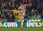 <p>Stoke City’s Ramadan Sobhi (right) and Crystal Palace’s Damien Delaney fight for the ball</p>