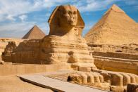 <p>The <a href="https://www.smithsonianmag.com/history/ancient-egypt-shipping-mining-farming-economy-pyramids-180956619/" rel="nofollow noopener" target="_blank" data-ylk="slk:monumental pyramids;elm:context_link;itc:0;sec:content-canvas" class="link ">monumental pyramids</a> of Giza stand as a reminder of the ancient Egyptians' innovative thinking and engineering. These tombs, filled with the belongings of Egypt's pharaohs, were erected to help guide the leaders into the afterlife. </p><p>Pharaoh Khufu began the first and largest Giza pyramid around 2550 B.C., which is thought to be made of 2.3 million stone blocks. Khufu’s son, Pharaoh Khafre, not only built the second pyramid, but also the Sphinx, whose face is said to resemble the pharaoh’s. The last and smallest tomb for Pharaoh Menkaure features a complex mortuary temple with elaborate paintings and inscriptions.</p>