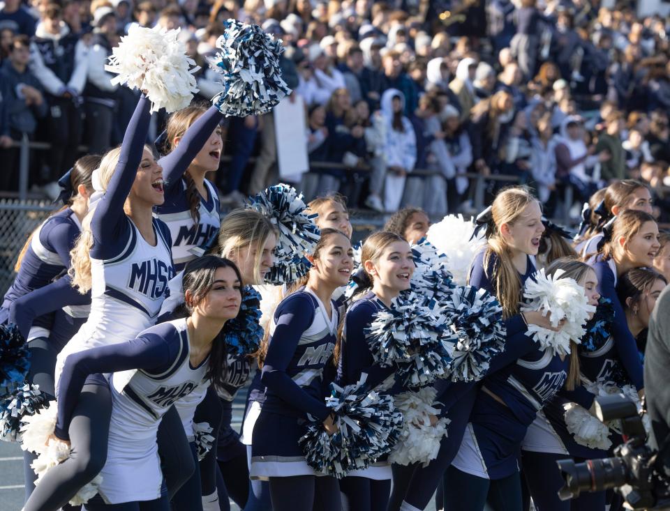 Cheerleaders celebrate after an extra point. Middletown South defeats Middletown North in Thanksgiving Day game on November 24, 2022 in Middletown NJ. 