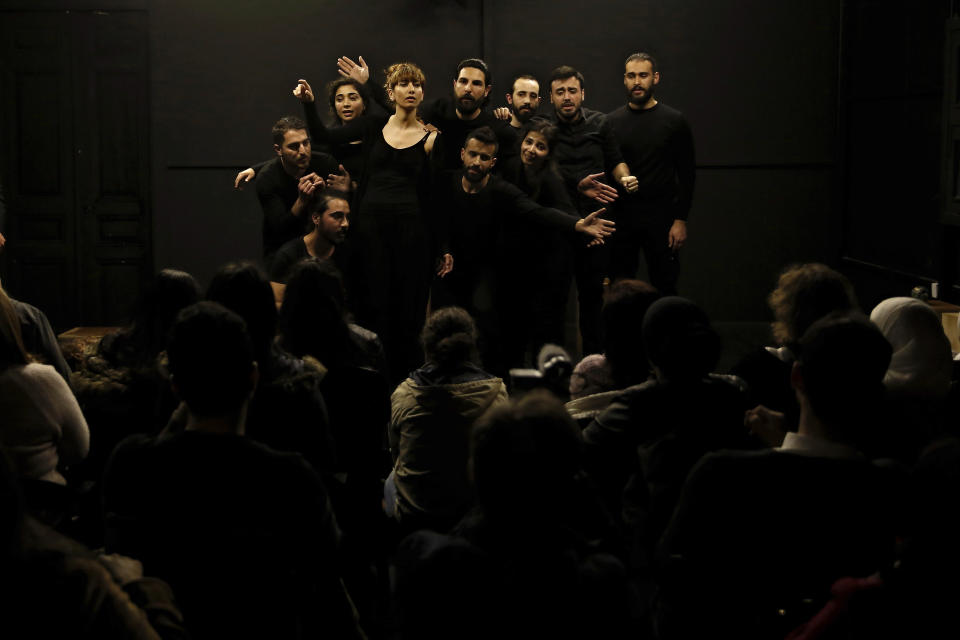 In this Friday, Feb. 8, 2019 photo, a team of Syrian actors takes part in a playback theater at the end of a three-month training session, in Beirut, Lebanon. Syrians from different parts of their war-torn country have gathered inside a theater telling their stories that are later re-acted by a group of Syrians who have been training on playback theater. (AP Photo/Bilal Hussein)