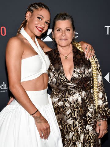 <p>Evan Agostini/Invision/AP</p> Trinity Rodman, left, and mother Michelle Moyer attend the Time100 Next