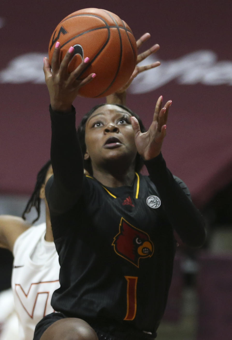 Louisville's Dana Evans scores against Virginia Tech in the second half of an NCAA college basketball game Thursday, Jan. 7, 2021, in Blacksburg, Va. (Matt Gentry/The Roanoke Times via AP, Pool)