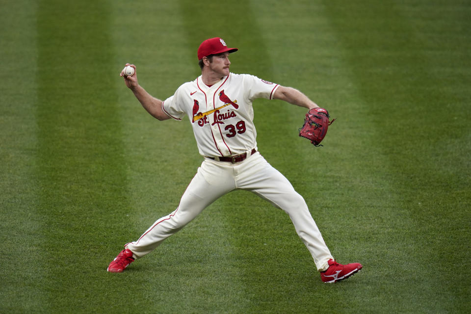 St. Louis Cardinals starting pitcher Miles Mikolas throws out Chicago Cubs' Ian Happ at first during the fourth inning of a baseball game Saturday, May 22, 2021, in St. Louis. (AP Photo/Jeff Roberson)