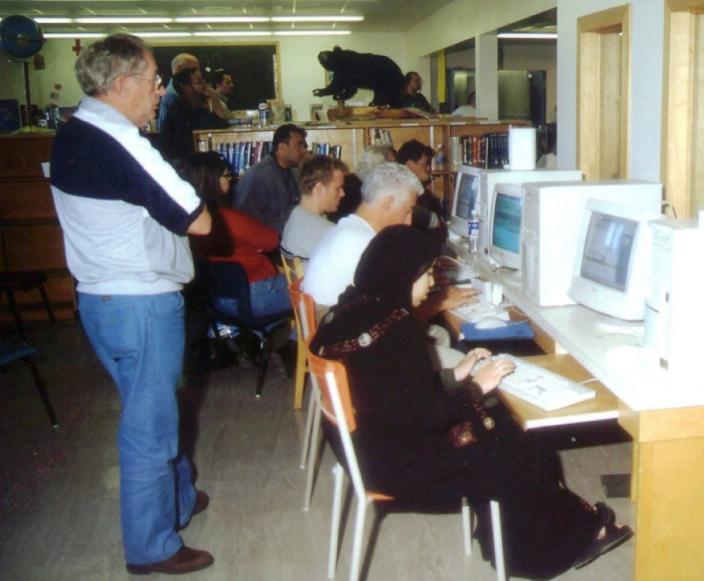 <div class="inline-image__caption"><p>In this Sept. 13, 2001 photo, stranded passengers take turns on computers at Gander Academy, an elementary school in Gander, Newfoundland, Canada, to communicate with their families.</p></div> <div class="inline-image__credit">Scott Cook/AP</div>