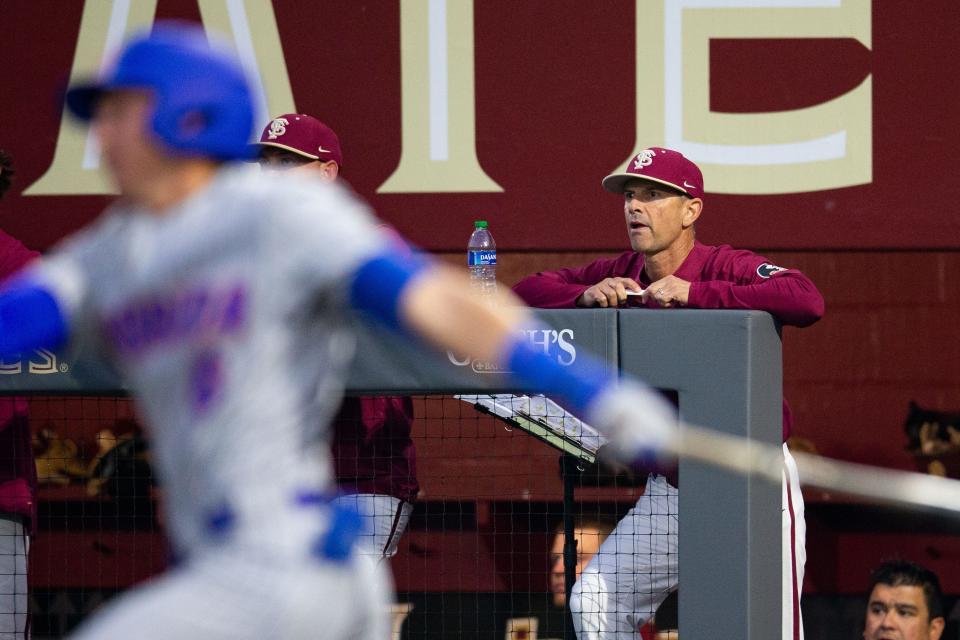 Florida State head coach Link Jarrett watches his players during a game. The Florida Gators defeated the Florida State Seminoles 9-5 on Tuesday, March 21, 2023. 