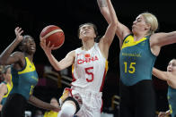 China's Siyu Wang (5) drives on Australia's Cayla George (15) during a women's basketball preliminary round game at the 2020 Summer Olympics in Saitama, Japan, Friday, July 30, 2021. (AP Photo/Eric Gay)