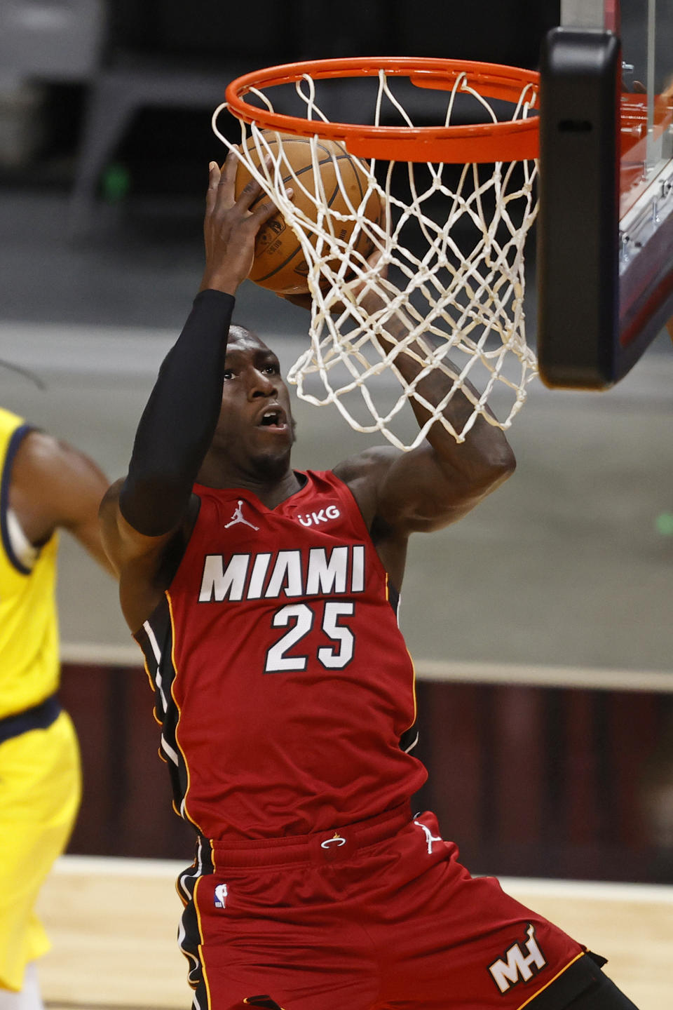 Miami Heat guard Kendrick Nunn (25) scores against the Indiana Pacers during the second half of an NBA basketball game Friday, March 19, 2021, in Miami. (AP Photo/Joel Auerbach)