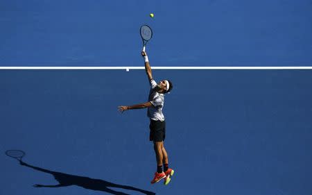 Tennis - Australian Open - Melbourne Park, Melbourne, Australia - 18/1/17 Switzerland's Roger Federer stretches to hit a shot during his Men's singles second round match against Noah Rubin of the U.S. REUTERS/Thomas Peter