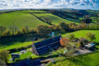 <p>As pretty as a picture book, Bramble Cottage has three bedrooms, a traditional country <a href="https://www.housebeautiful.com/uk/decorate/kitchen/a31990026/kitchen-lighting-ideas/" rel="nofollow noopener" target="_blank" data-ylk="slk:kitchen;elm:context_link;itc:0;sec:content-canvas" class="link ">kitchen</a>, roaring fireplaces and wraparound countryside views. </p><p><a href="https://www.onthemarket.com/details/9584073/v" rel="nofollow noopener" target="_blank" data-ylk="slk:This property is currently on the market for £300,000 with Michael Adey Property at OnTheMarket;elm:context_link;itc:0;sec:content-canvas" class="link ">This property is currently on the market for £300,000 with Michael Adey Property at OnTheMarket</a></p>