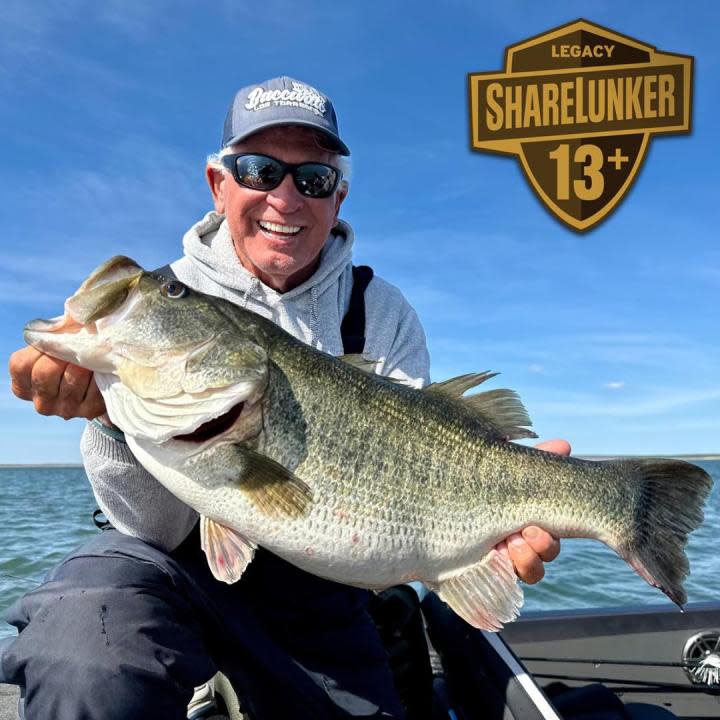 Larry Walker smiling with his 13.83-pound bass caught out of O.H. Ivie in 2024