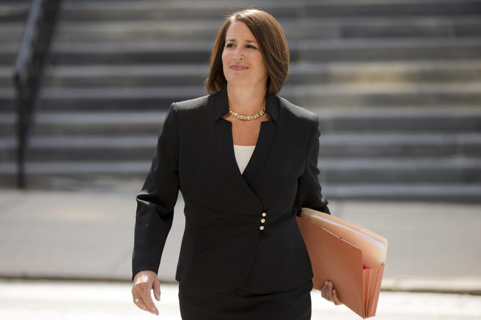 FILE - In this Thursday, Aug. 6, 2015, file photo, former Montgomery County District Attorney Risa Vetri Ferman walks to a news conference, in Norristown, Pa. Ferman helped run the initial investigation of Bill Cosby's sexual assault case and reopened it in 2015 when she was district attorney. Cosby was convicted of sexual assault in 2018. He is serving up to 10 years in prison. Now in the midst of another historic reckoning, this time addressing the treatment of African Americans and other people of color by police and the criminal justice system, the 82-year-old Cosby has won the right to an appeal. (AP Photo/Matt Rourke, File)