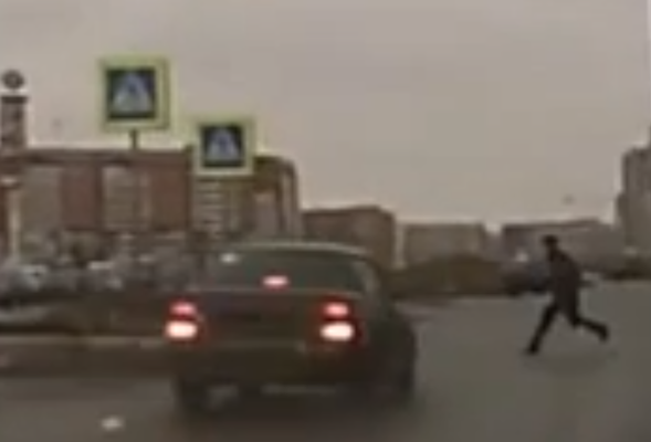 Russian pedestrian flipped over car