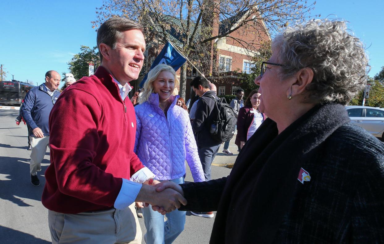Governor Andy Beshear is greeted by UofL President Kim Schatzel on the campaign trail at the University of Louisville on Thursday, November 2, 2023