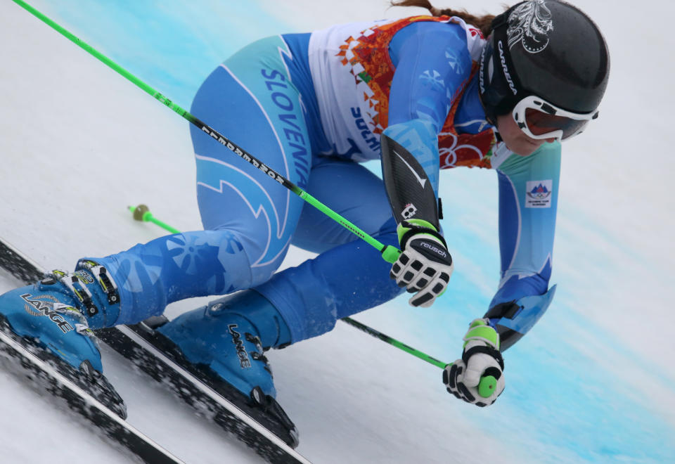 Slovenia's Tina Maze makes a turn in the second run of the women's giant slalom to win the gold medal at the Sochi 2014 Winter Olympics, Tuesday, Feb. 18, 2014, in Krasnaya Polyana, Russia. (AP Photo/Alessandro Trovati)