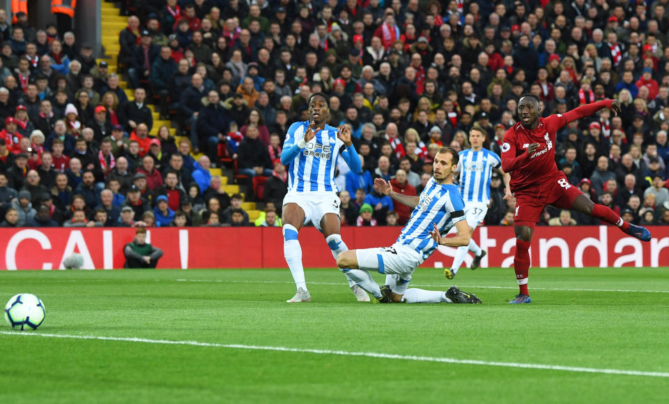 LIVERPOOL, ENGLAND - APRIL 26:  Naby Keita of Liverpool (8) scores his team's first goal during the Premier League match between Liverpool FC and Huddersfield Town at Anfield on April 26, 2019 in Liverpool, United Kingdom. (Photo by Michael Regan/Getty Images)