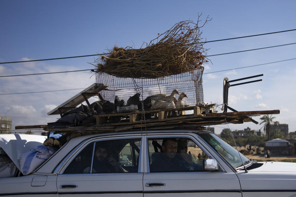 Palestinians arrive in the southern Gaza town of Rafah after fleeing an Israeli ground and air offensive in the nearby city of Khan Younis on Wednesday, Jan. 24, 2024. Israel has expanded its offensive in Khan Younis, saying the city is a stronghold of the Hamas militant group. (AP Photo/Fatima Shbair)