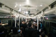 NEW YORK, NY - DECEMBER 16: People crowd into a vintage New York City subway car as people dance to a live band on December 16, 2012 in New York City. The New York Metropolitan Transportation Authority (MTA) runs vintage subway trains from the 1930's-1970's each Sunday along the M train route from Manhattan to Queens through the first of the year. (Photo by Preston Rescigno/Getty Images)