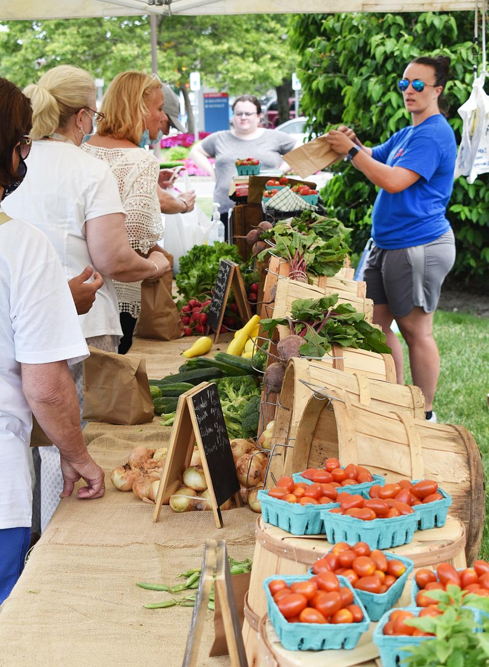 In this 2021 file photo, city residents line up for fresh produce at the Fall River Farmers Market.