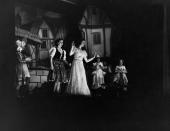 <p>Princess Elizabeth shines on stage in a flowing white dress, as she performs alongside her sister in their annual Christmas pantomime. This year, the show was Old Mother Red Riding Boots.</p>