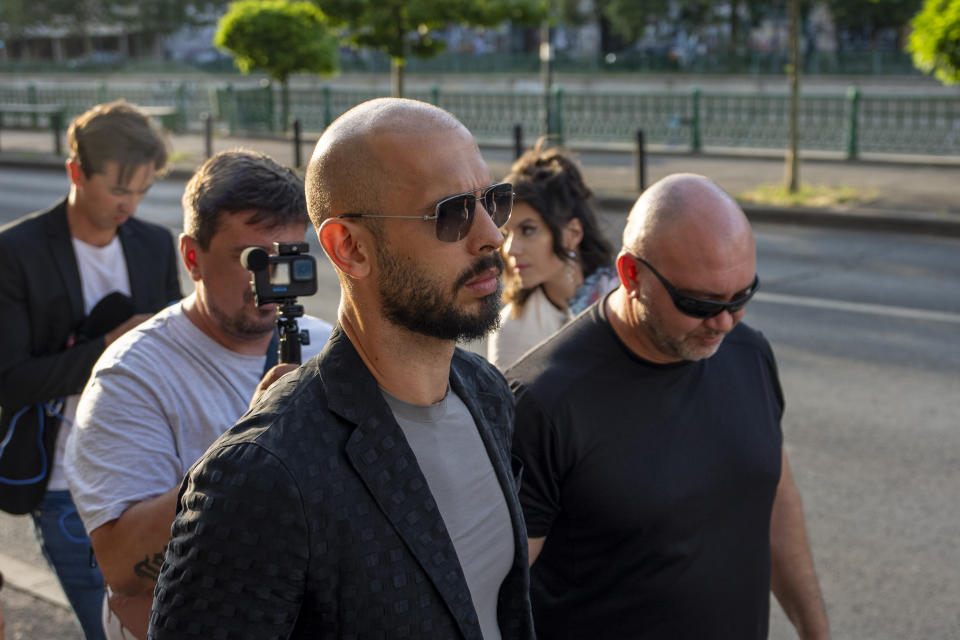 Andrew Tate leaves the Court of Appeal in Bucharest, Romania, Thursday, July 6, 2023. Andrew Tate, the divisive social media personality and former professional kickboxer who is charged in Romania with rape, human trafficking, and forming a criminal gang to sexually exploit women, lost an appeal on Thursday against a court's earlier decision to keep him under house arrest, his spokesperson said. (AP Photo/Andreea Alexandru)