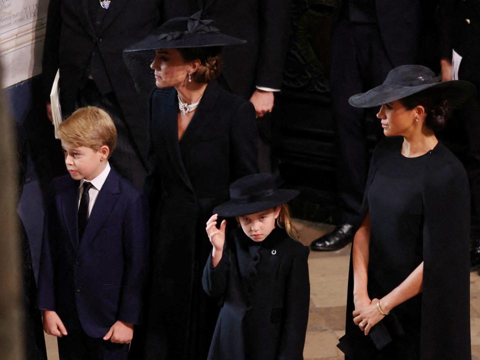 Kate Middleton, Meghan Markle, Prince George, and Princess Charlotte at Queen Elizabeht II's funeral.