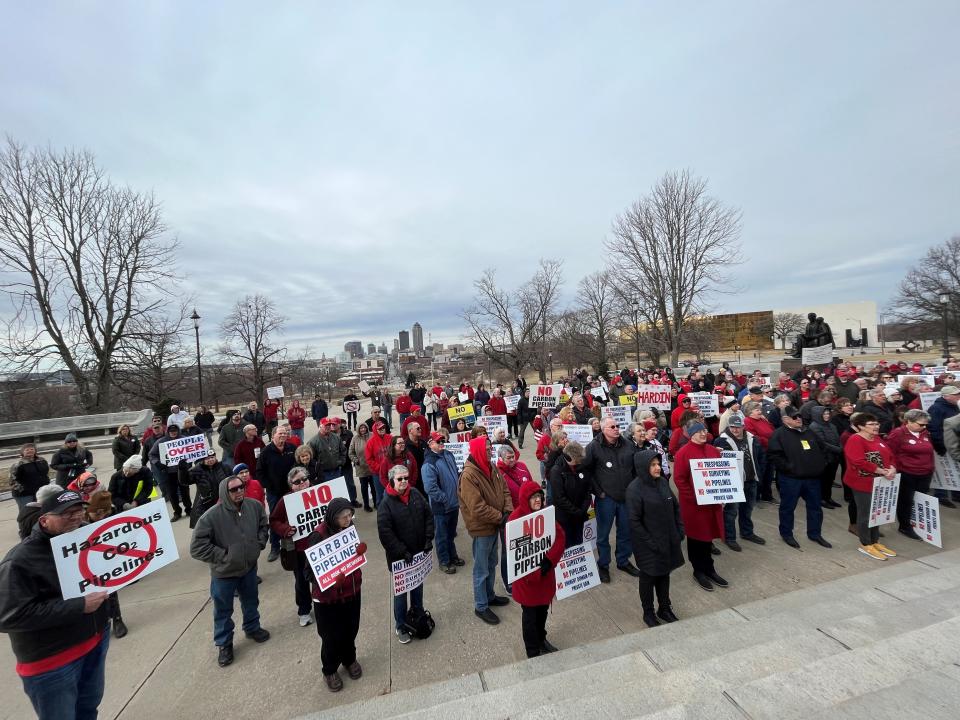 Iowans gather for a rally at the state Capitol on Feb. 21 in opposition to the use of eminent domain to build carbon capture pipelines in Iowa.