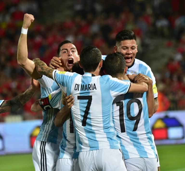 Argentina players celebrate after teammate Gabriel Mercado (obscured) scored against Chile during their 2018 FIFA World Cup South American qualifier in Santiago on March 24, 2016