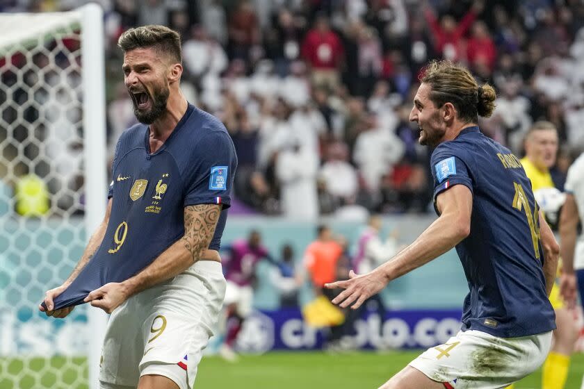 France's Olivier Giroud celebrates after scoring his side's second goal during the World Cup quarterfinal soccer match between England and France, at the Al Bayt Stadium in Al Khor, Qatar, Saturday, Dec. 10, 2022. (AP Photo/Christophe Ena)